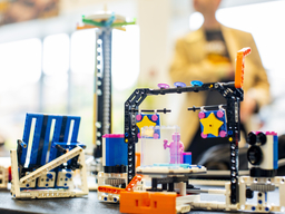 Lego structure of a person performing on a stage.