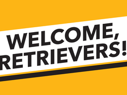 yellow field with white banner that reads "WELCOME, RETRIEVERS!"