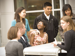 Students around a table having a conversation