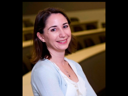 headshot of smiling woman in classroom