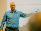UMBC professor Weic Stokan lecturing